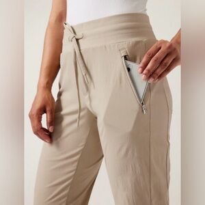 ATHLETA Trekkie North Jogger NWT -
Size 14 Women's Tan Pants with Zipper Pocket